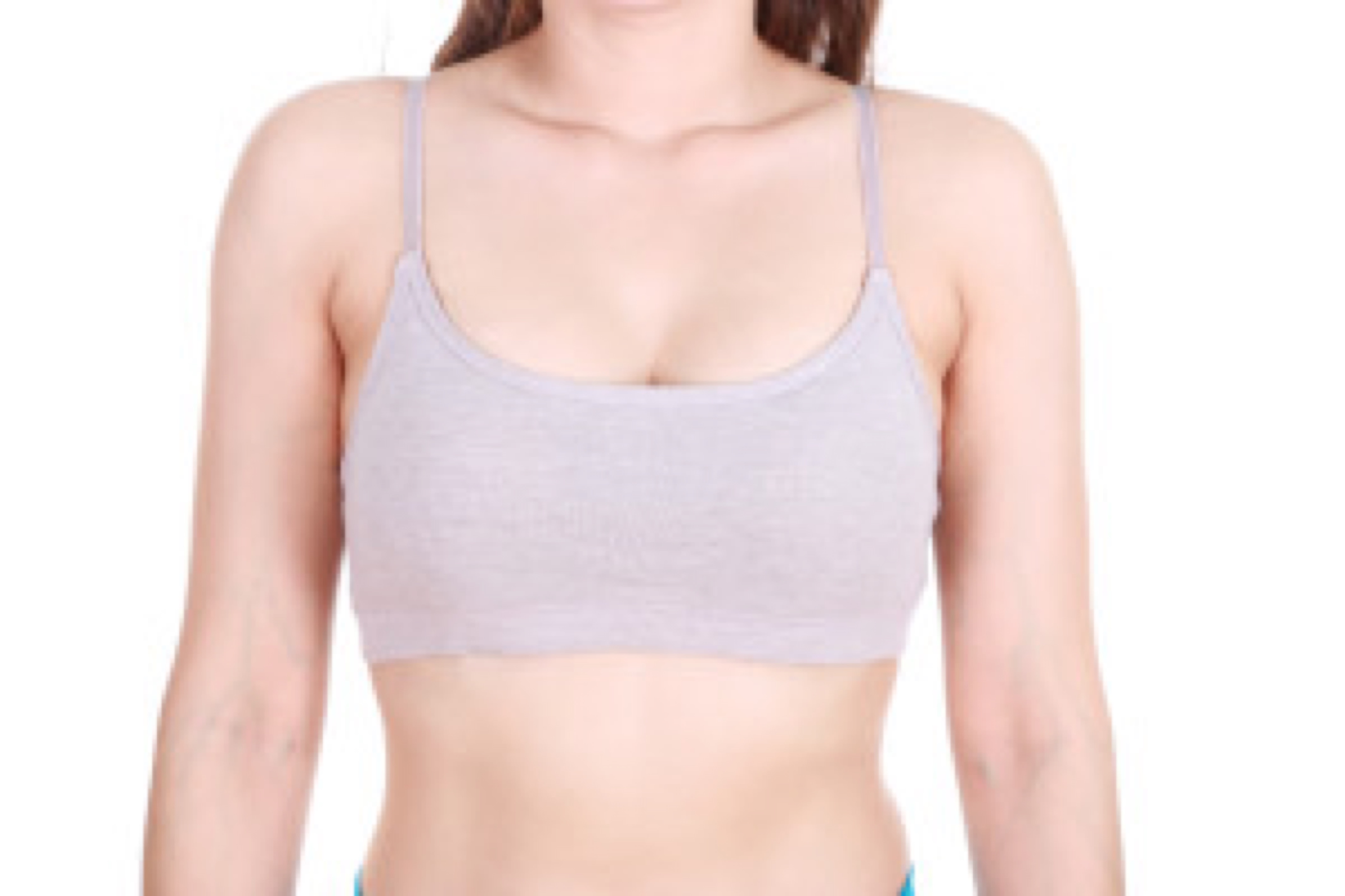 close up of a woman's chest in her sports bra