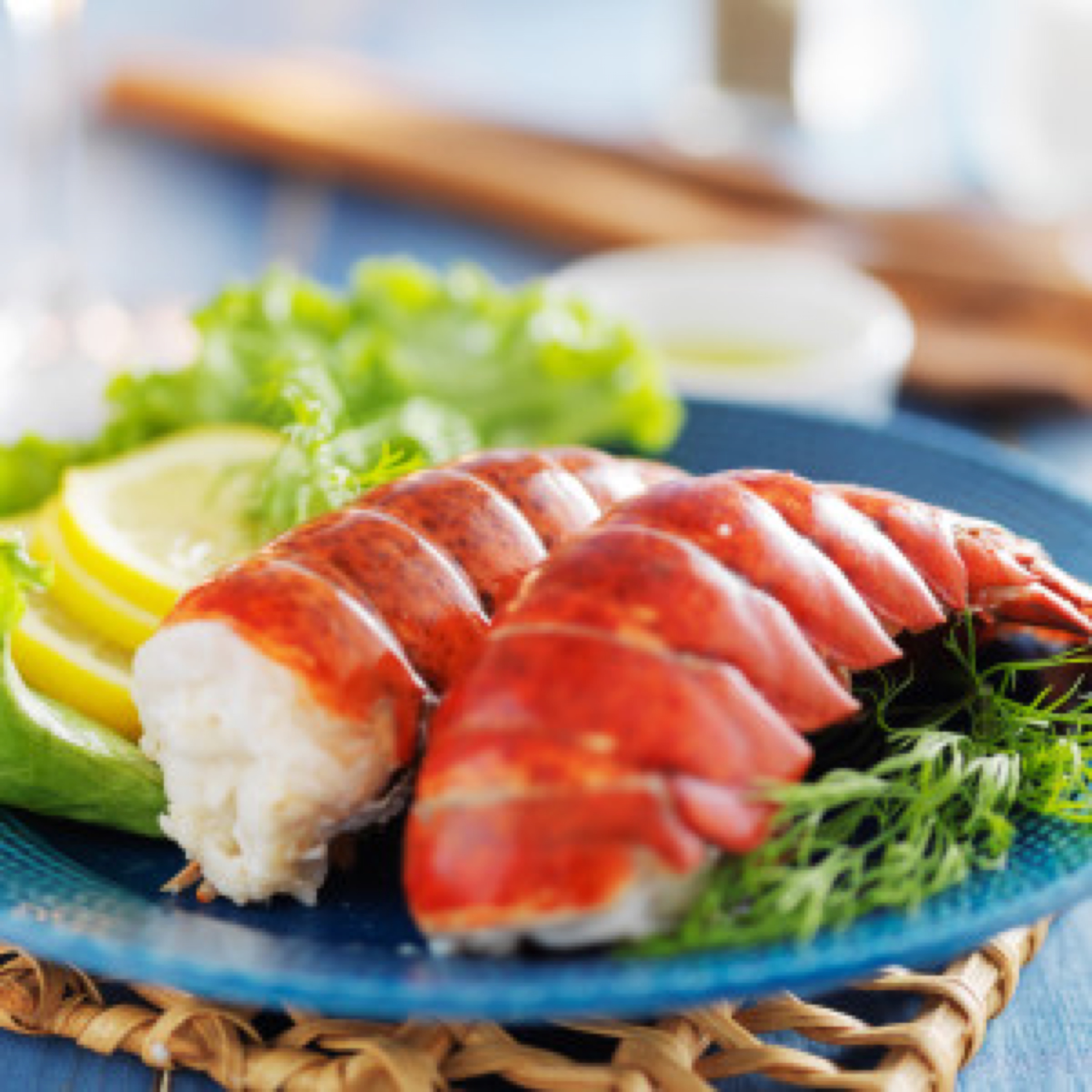 lobster dinner with lemon and lettuce garnish